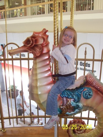 Nyla riding on a seahorse.