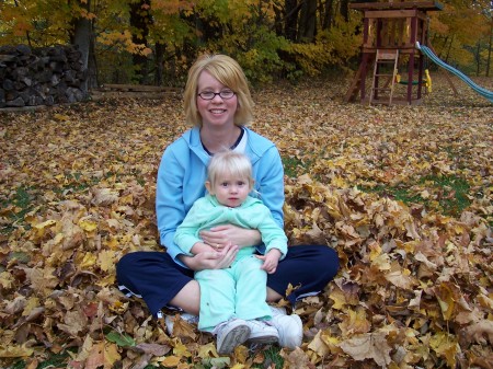 Kelly and Elizabeth playing in the leaves.