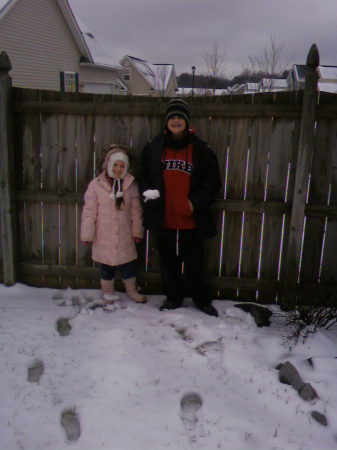 tristan & faith in snow in backyard