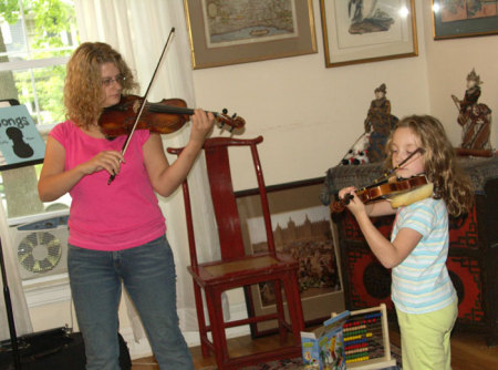 Still play violin and six months pregnant