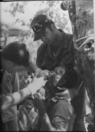 Assisting dentist on 1968 med cap mission
