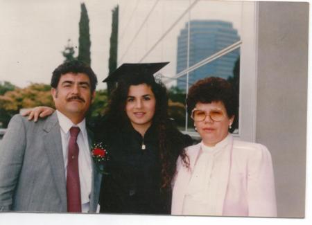 My Dad and Mom with me at my High School Grad