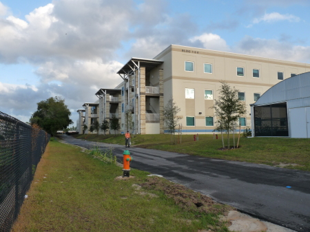 The classroom buildings behind the entrance