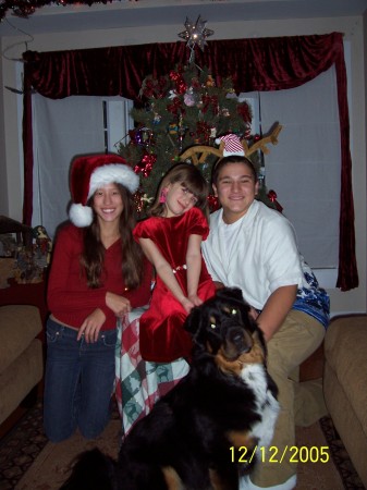 My goofy kids at Christmas plus Loosey our doggy.