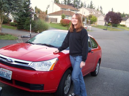 My daughter Nicole with her baby, her car Dec