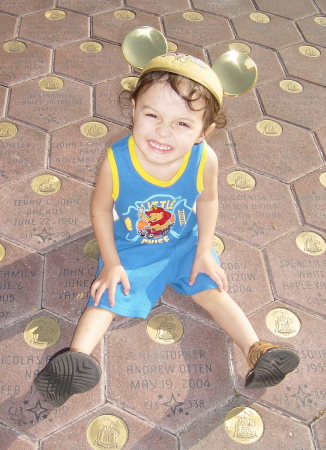 My Christopher sitting on top of his Disneyland paver.