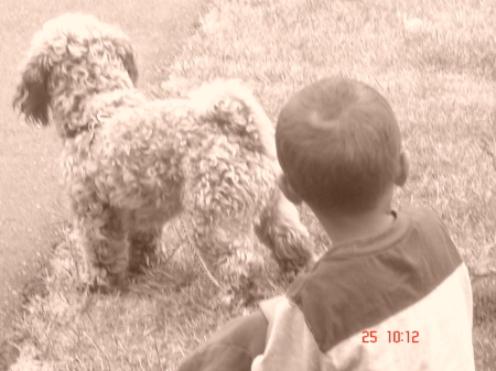 i love photography  i won a contest with this one of my grandson and dog