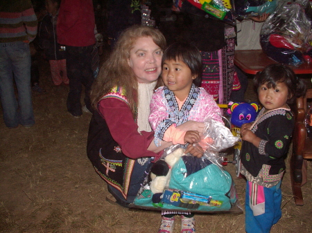 Cavell with Hmong child at Christmas celebration in Thailand