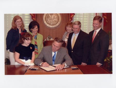 Governor Bush signing the "Kelsey Ryan Act" into law