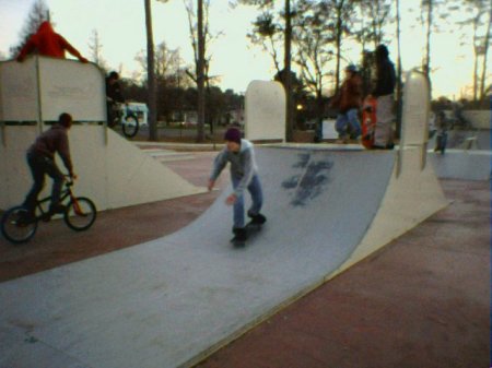 Justin skateboarding the halfpipe