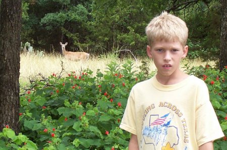 My middle son in his natural habitat (outdoors) 6-25-06