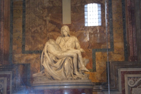 That's me resting on the lap of a kind woman named Mary that I met in Rome.  It had been a long day of sightseing and I was exhausted.  Who says I have a Messiah complex!?!