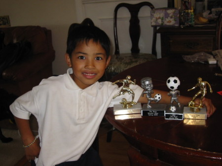 Grayson and his Soccer trophies...