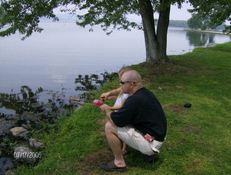 Daddy teaching Jordan how to fish