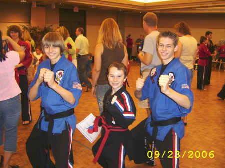 Tavis getting advanced to red belt and his instructors