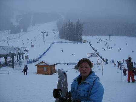 Me holding a snowboard and YES, I went down the hill...OUCH!