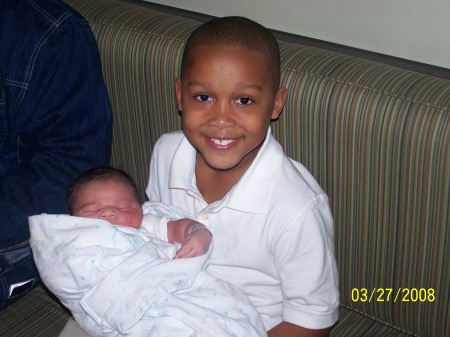 My son T.J. hold his new little brother