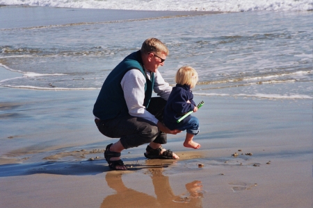 Papa introducing Megan to the cold Pacific