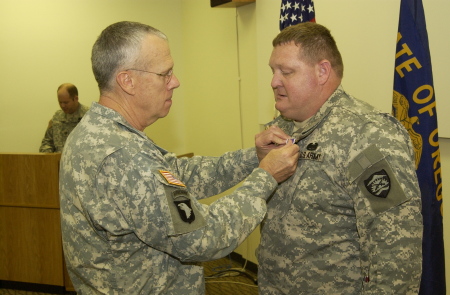 2 star general pinning the purple heart on my hubby
