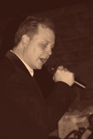 My husband singing to me at our wedding