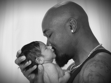 Daddy kissing Baby