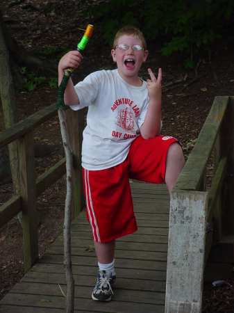 happy camper with his walking stick creation