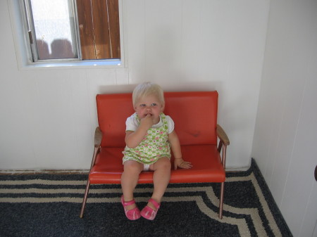 Elley sitting in her playhouse