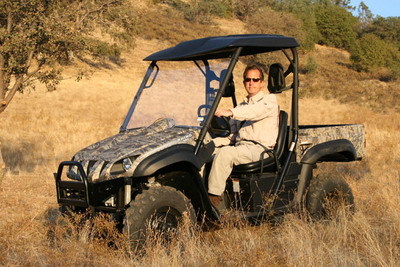 My Hubby of 18 years, Terry, in his Rhino on our property