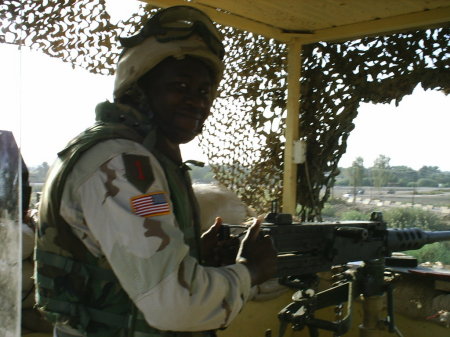 Me manning .50 cal on North Gate overwatch tower, Iraq