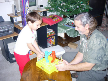 My nephew Jeremy getting ready to "knock my block off" on X-Mas 2006!