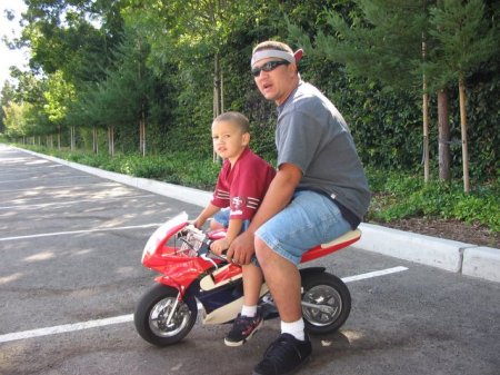 HERE IS JEFFREY ON HIS MINI MOTORCYCLE WITH HIS DADDY CHAD !!