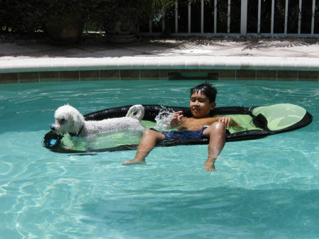 My son Lawrence and Snowy in the pool - Christmas 2006