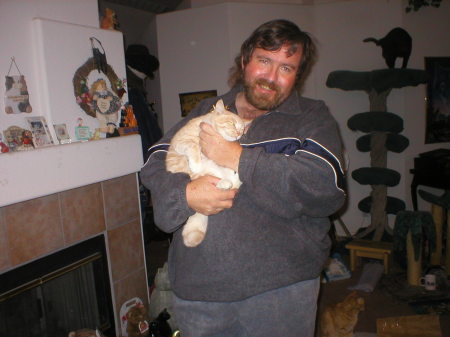 Husband Jim holding one of our cats (Nathan) 2003 Xmas