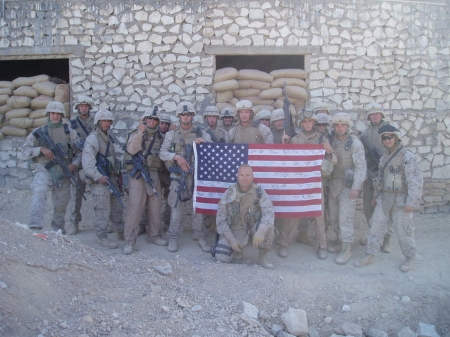 JASON (IN FRONT OF FLAG) WITH HIS GUYS IN IRAQ