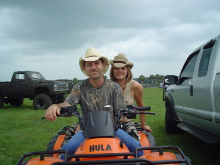 My wife and I ridin the four wheeler before one of our shows