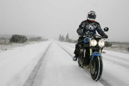 Ken Freund riding a Triumph Speed Triple in a snowstorm