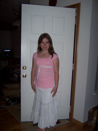 Ashley in her sixth grade graduation outfit