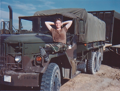 Me resting on a 2.5 ton military cargo truck.