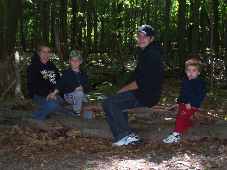 "Ross" boys taking a break on a fallen tree at Hartwick Pines