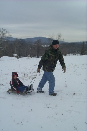 Sledding with my son while I was home on R&R.