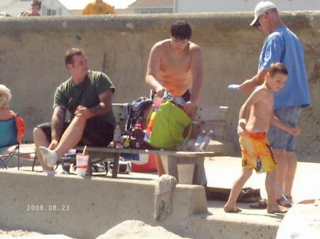 sons at beach with grandparents