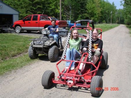 my kids.. Sam, Amy,  and Girlfriends' boy Cody out playin around on the toys