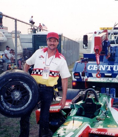 PHOTO WITH WHATS LEFT OF ADRIAN FERNANDEZ'S CAR