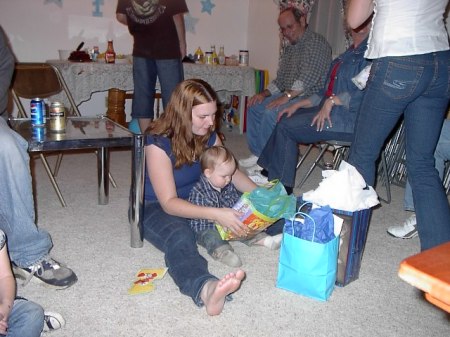 Mom and Alex opening gifts