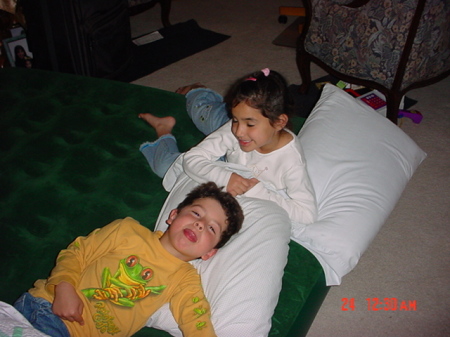 Tessa and Tristen having the last vestiges of a pillow fight!