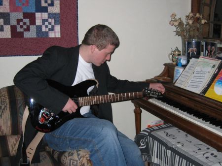 My Son tuning his guitar