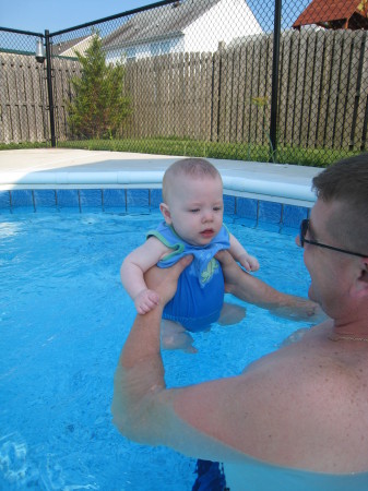 Baby Kyle takes his first swim