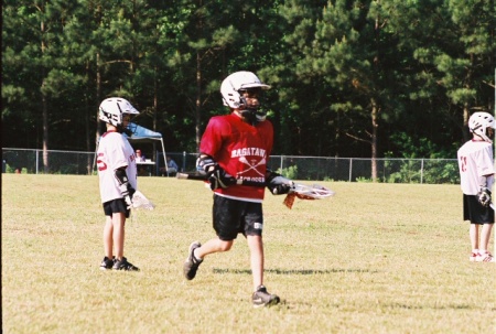 Andrew playing Lacrosse