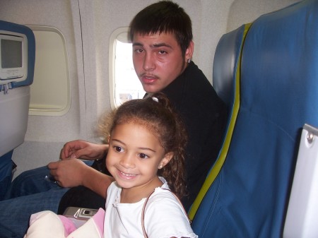 My son Joey and Grandaughter Arianna on the plane to New York 2005