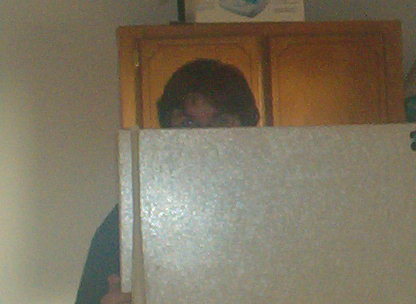 Justin hiding or doing what he does best (Laundry room Fridge)